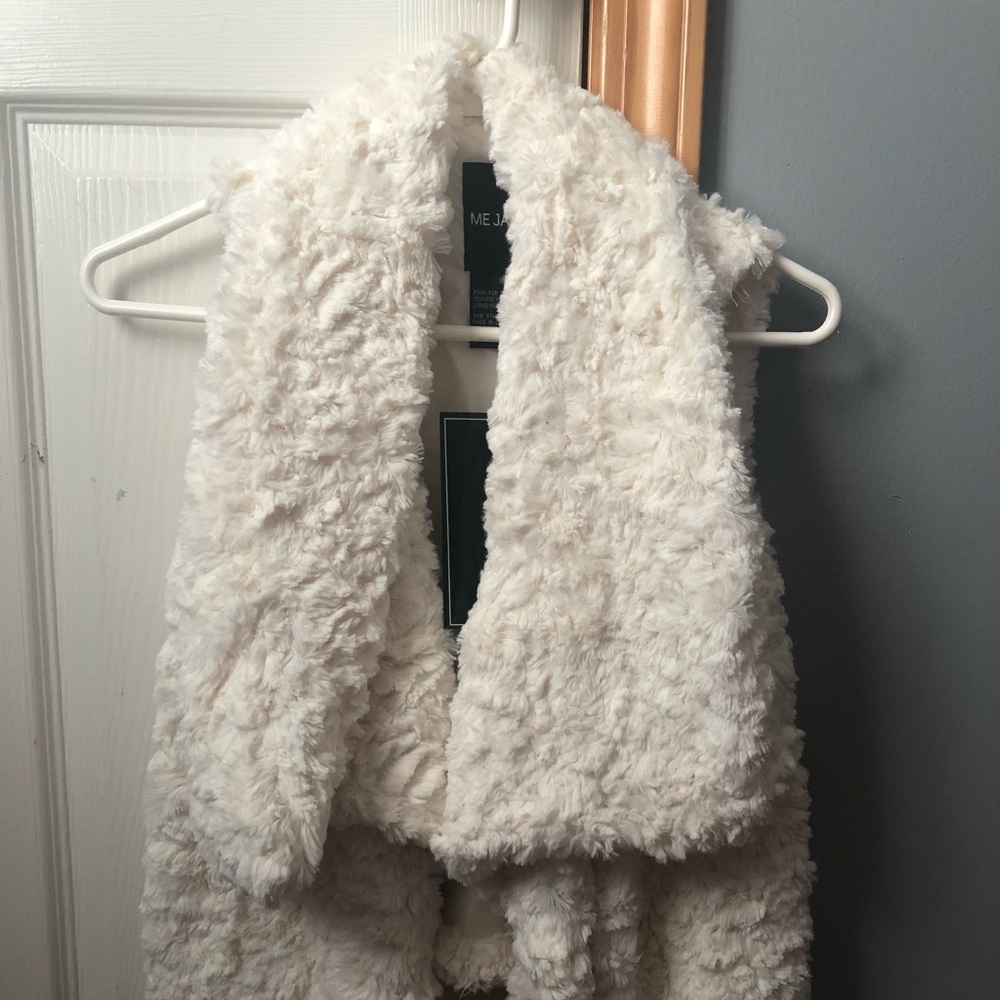 Cream colored faux fur vest